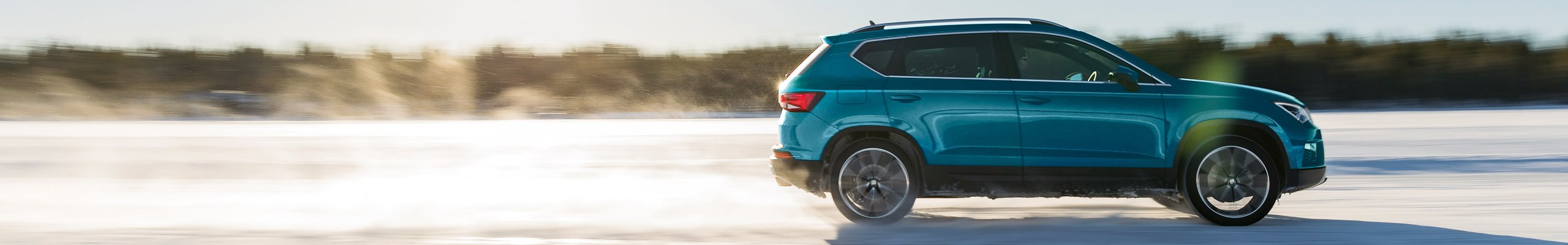 Side view of an Ateca on a road