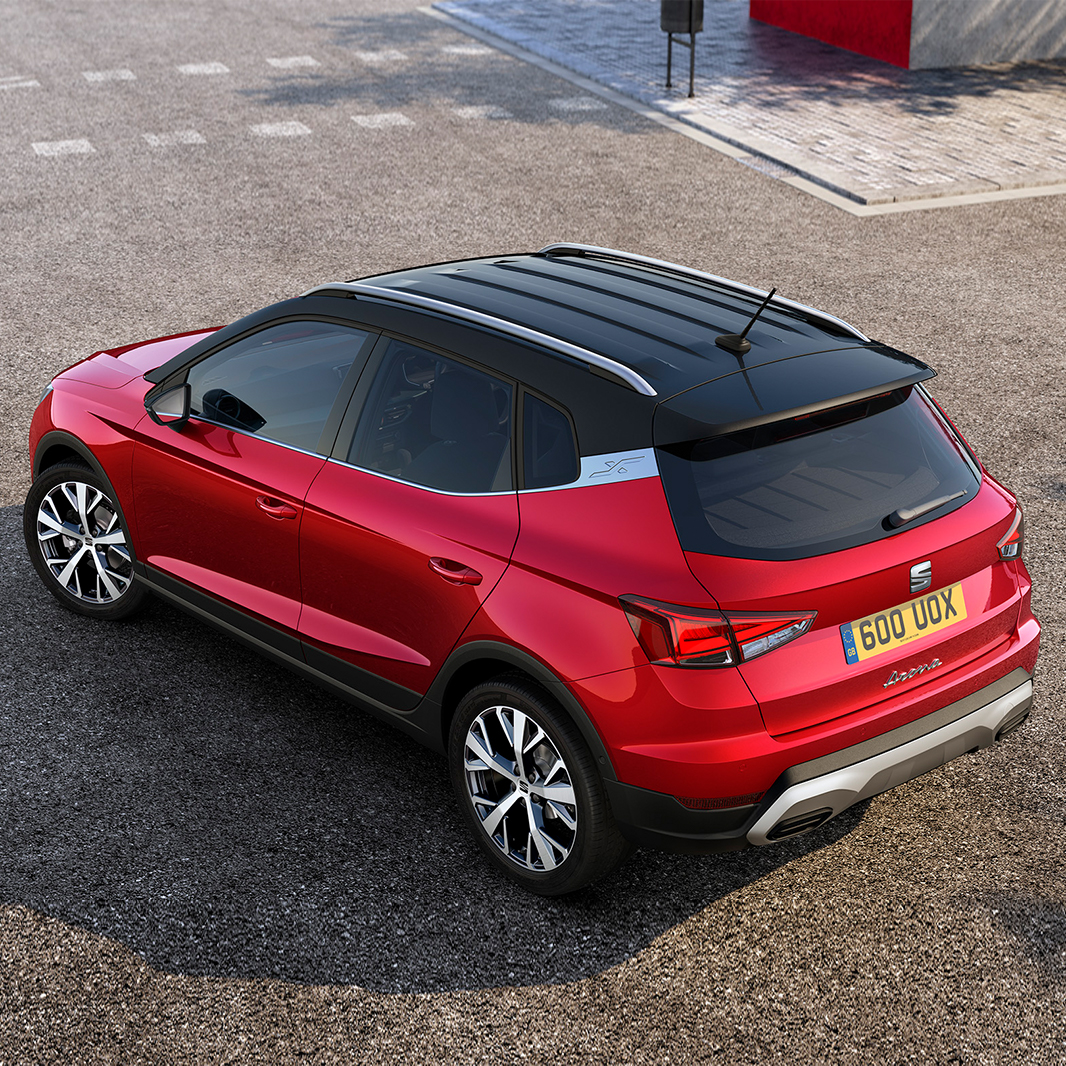 SEAT Arona dark camouflage colour with white candy roof and rear mirror