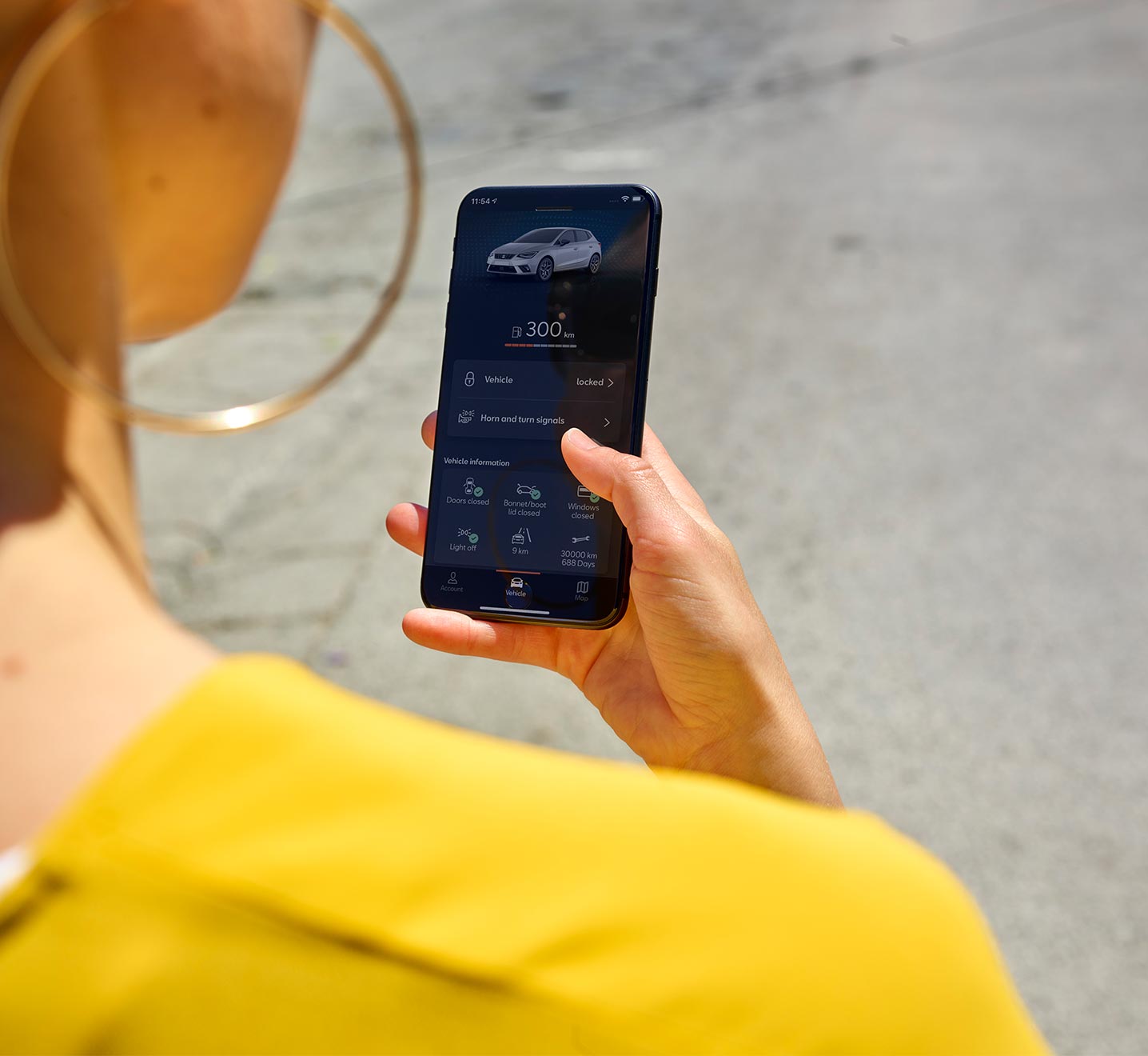 Woman connected to SEAT CONNECT app with her smartphone
