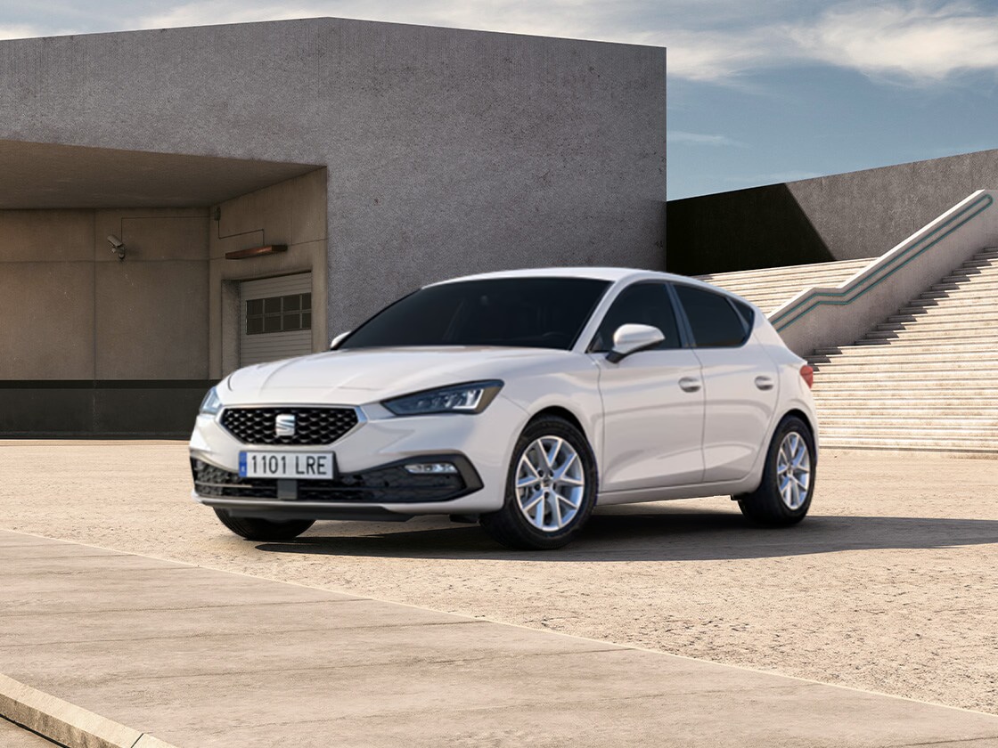 a white SEAT Leon SE parked on pavement next to steps