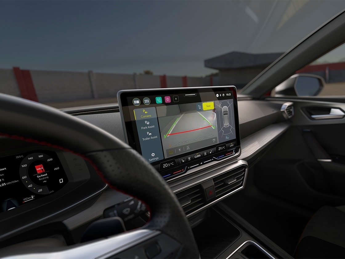 Interior view of the SEAT Leon Estate with touchscreen and park assist for parking smoothly.
