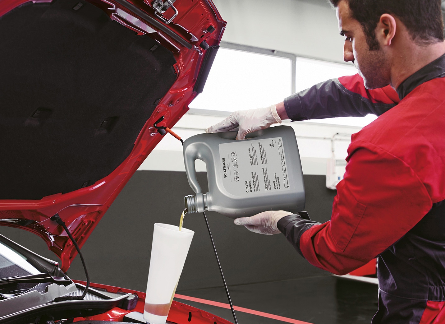 a man servicing a SEAT car at a dealership