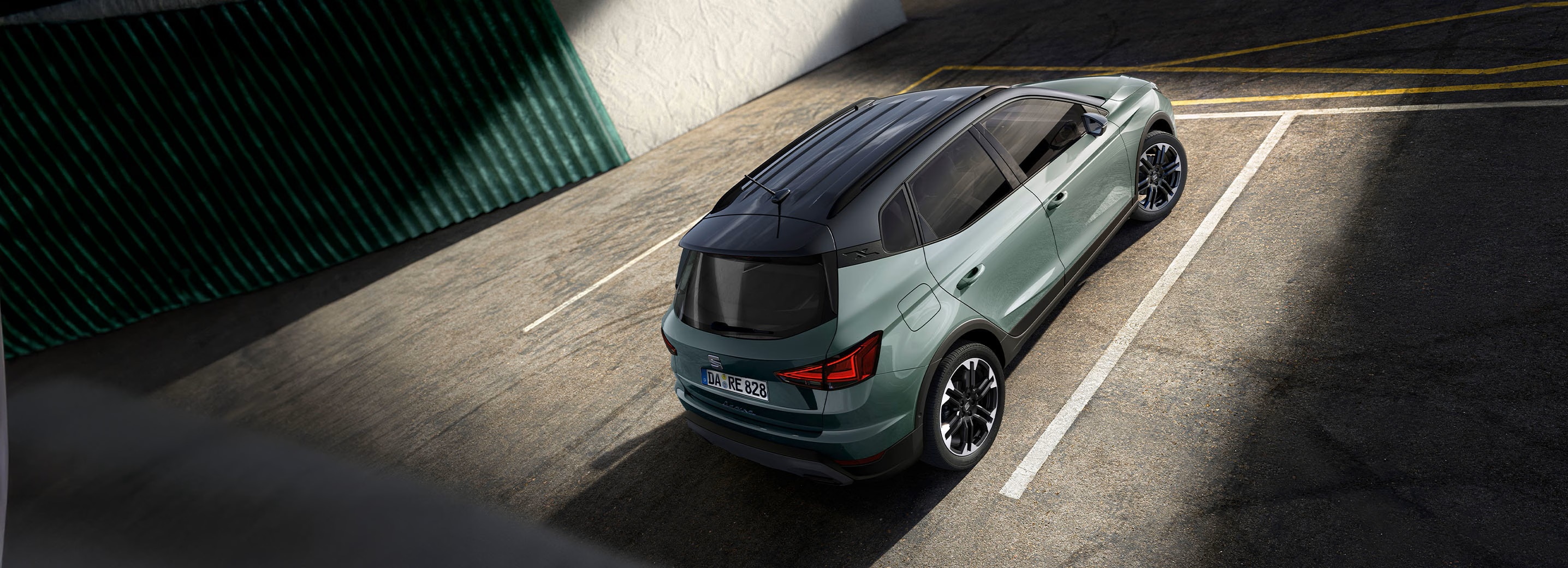 Back aerial view the new grey coloured SEAT Arona in a car park