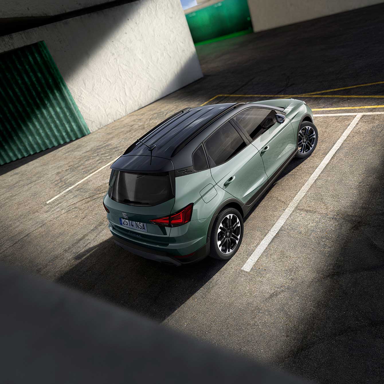 Top view angle of a light blue SEAT Arona with a grey roof colour in a car park