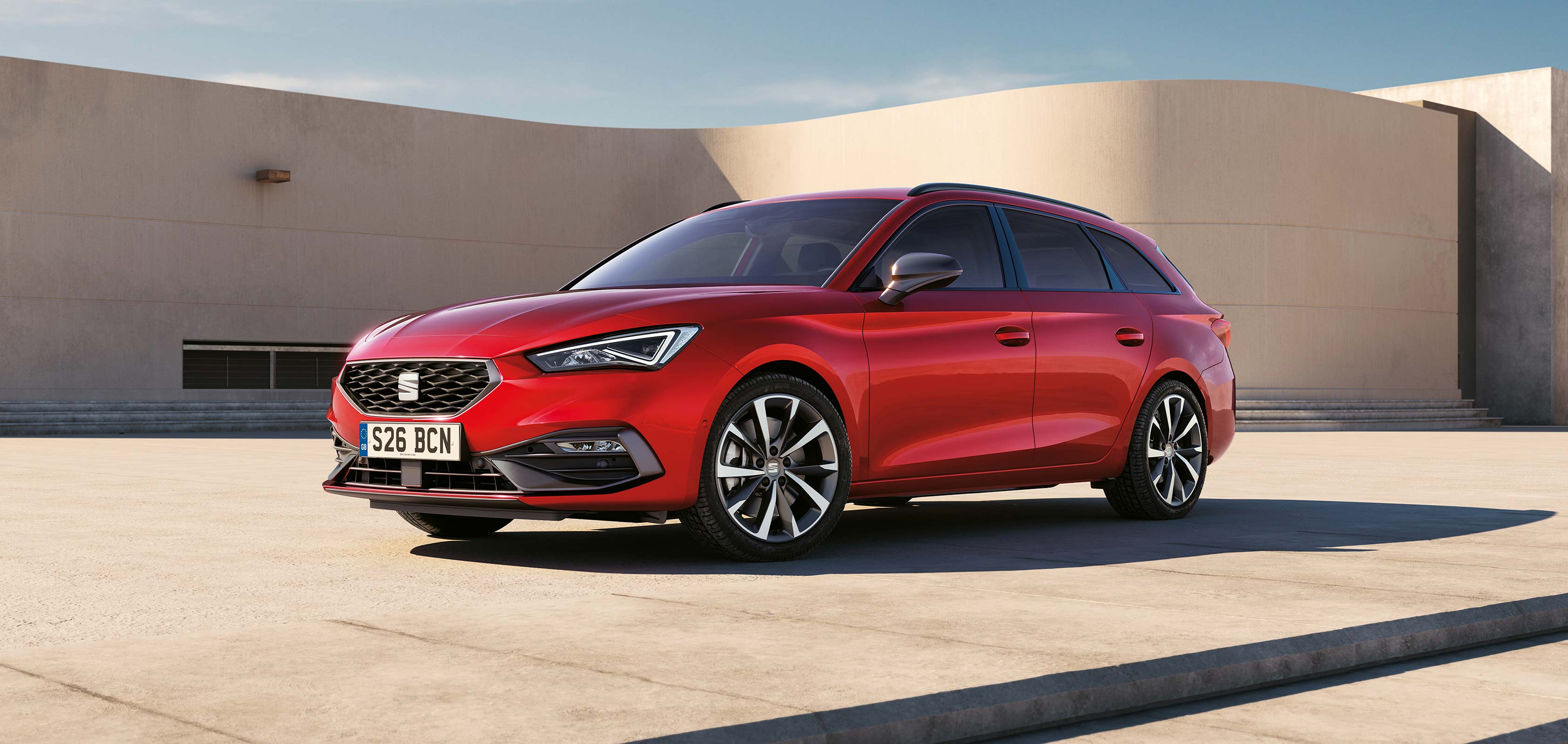 A red SEAT Leon Estate