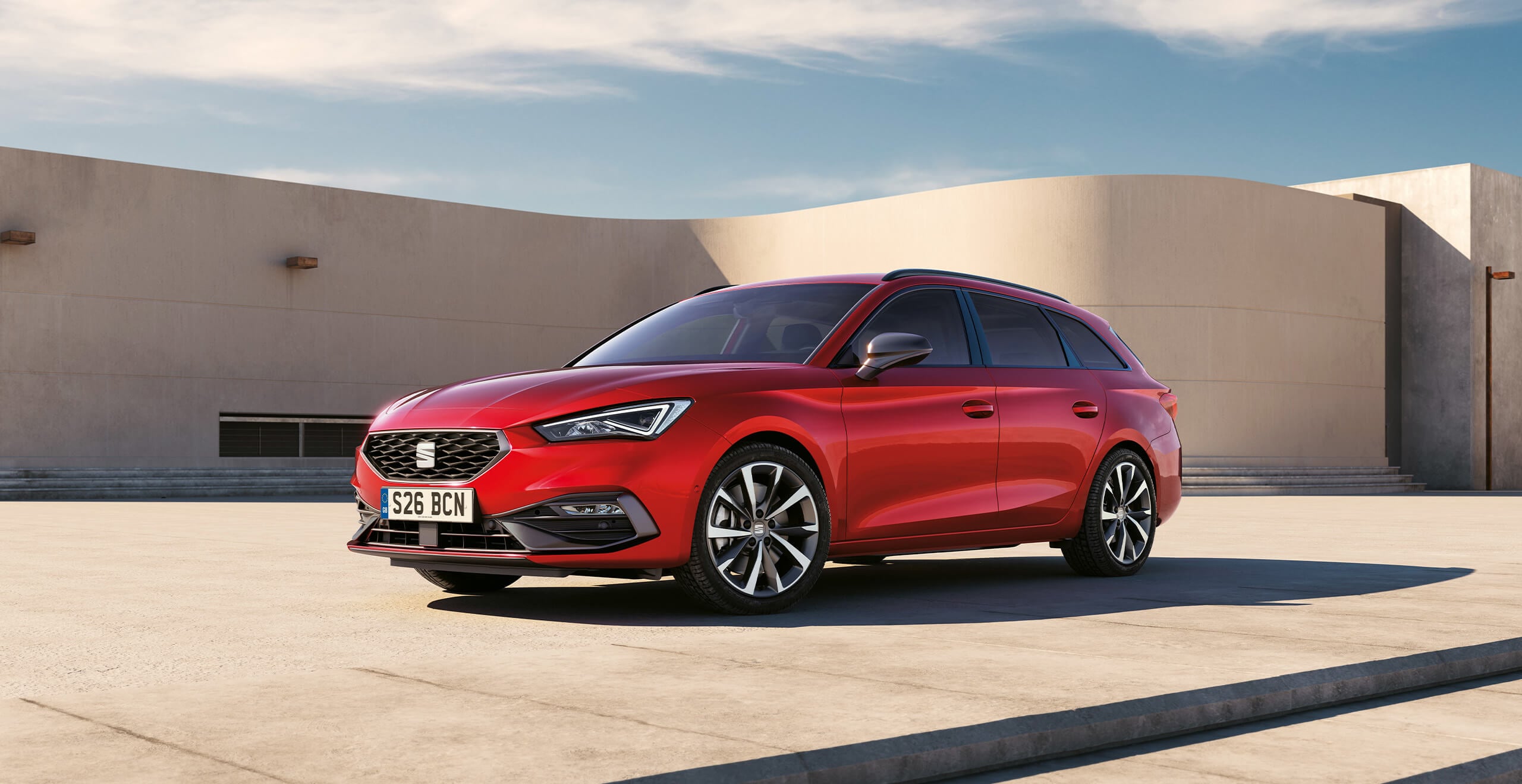 A red SEAT Leon Estate FR Sport in a car park