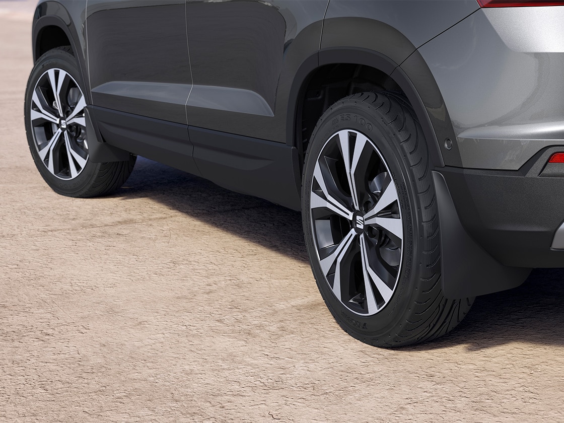 Close-up of a black SEAT Ateca showcasing the front and rear mudflaps