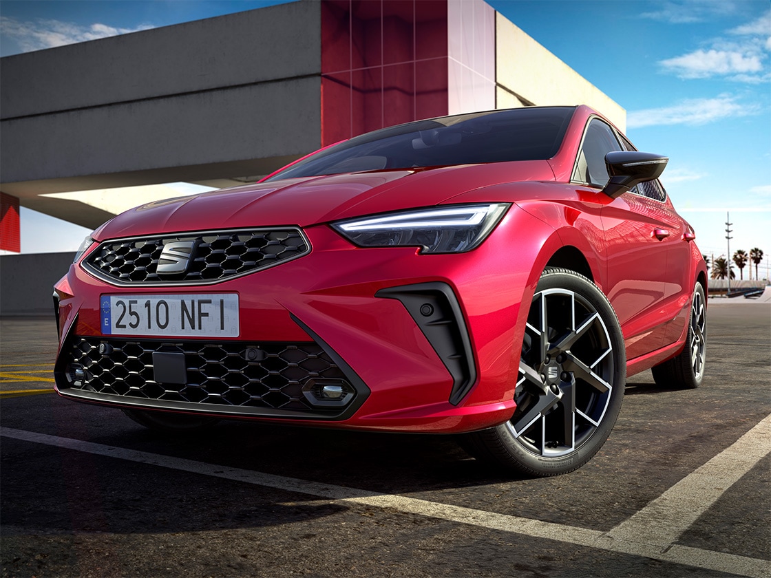 Low-angled view of the SEAT Ibiza in red to highlight its fog lamps design. 