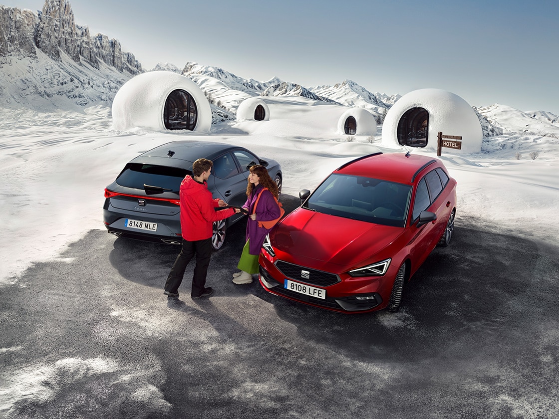 A red seat car in a snowy mountain setting with car insurance for vehicle coverage.