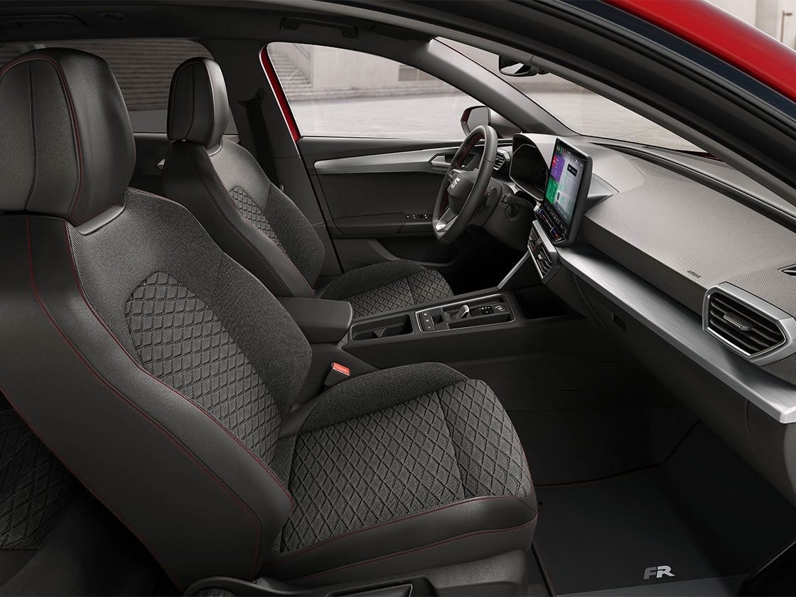 Interior view of SEAT Leon featuring FR cloth comfort seats, combining ergonomic support and stylish design for a comfortable journey.