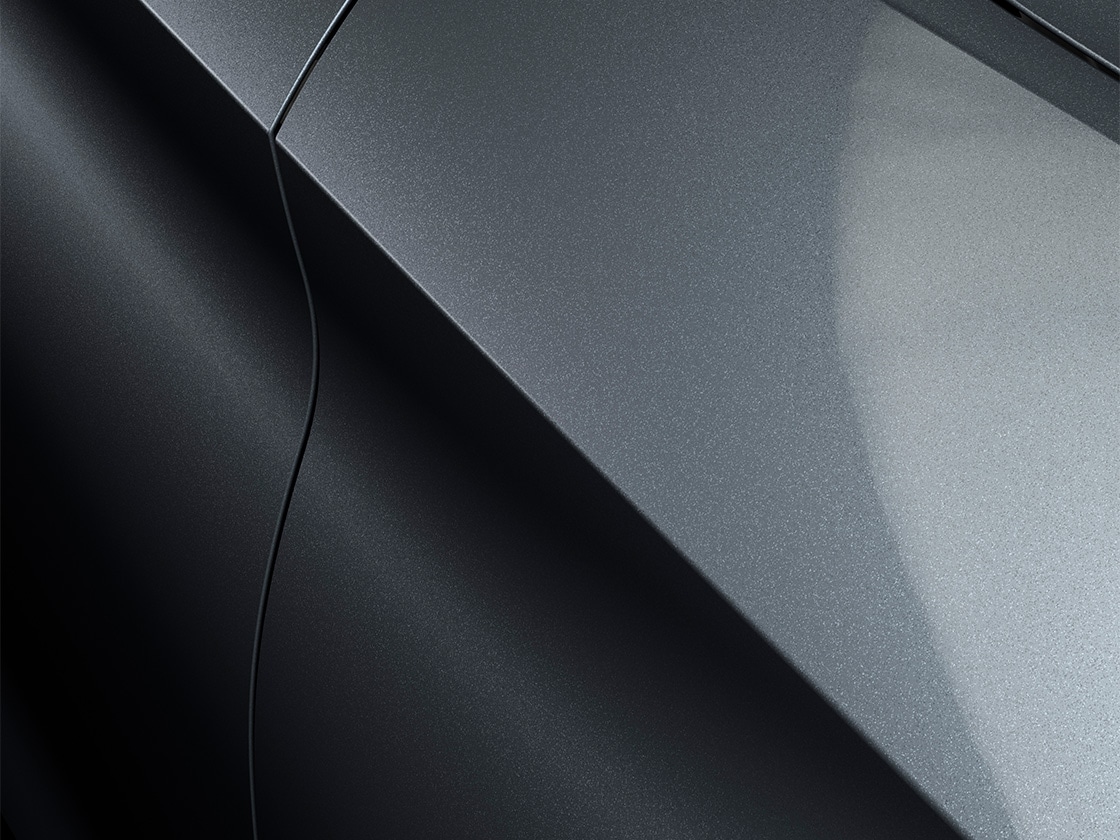 The leon  estate car, seat leon sportstourer in magnetic tech with a metallic finish, close up. 